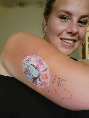 Woman with Whimsical Blossoms Dexcom G6 Tape on arm