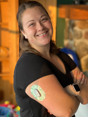 ExpreessionMed, Airy Florals Dexcom G6 Mini Tape, Happy woman wearing pastel green floral themed CGM Adhesive Patch
