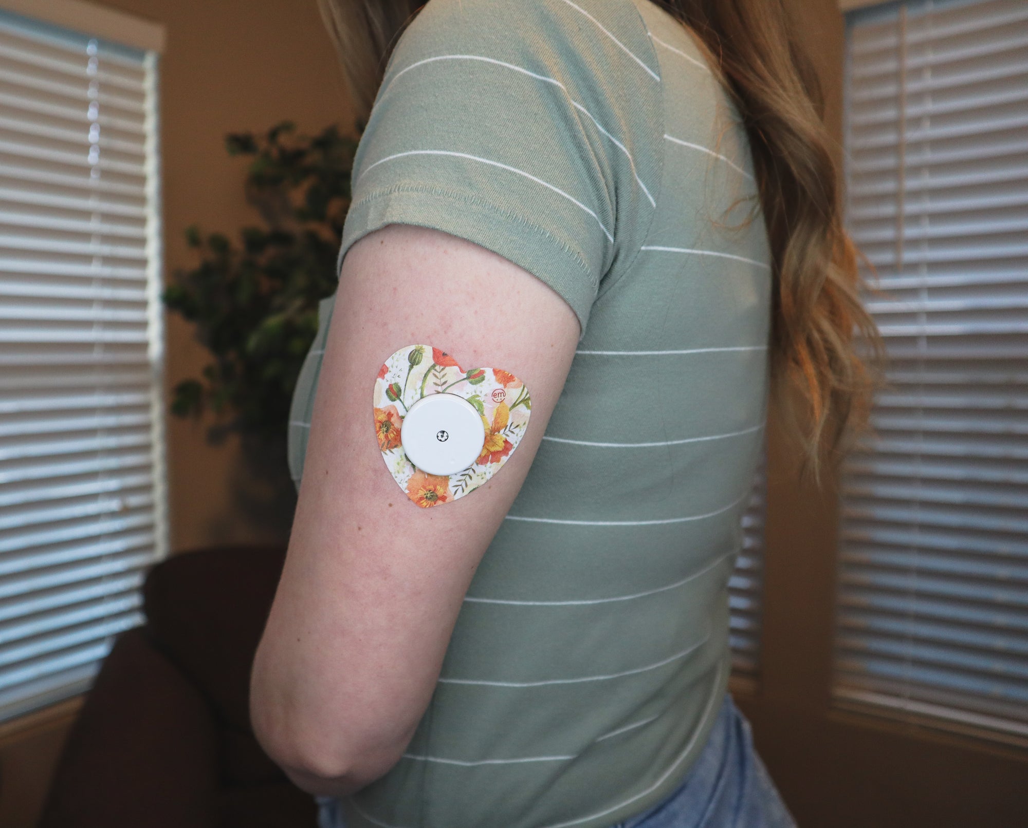 ExpressionMed Woman with Peachy Blooms Heart Libre Tape on arm, Abbott Lingo