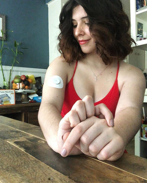 Woman with White Libre Tape on arm