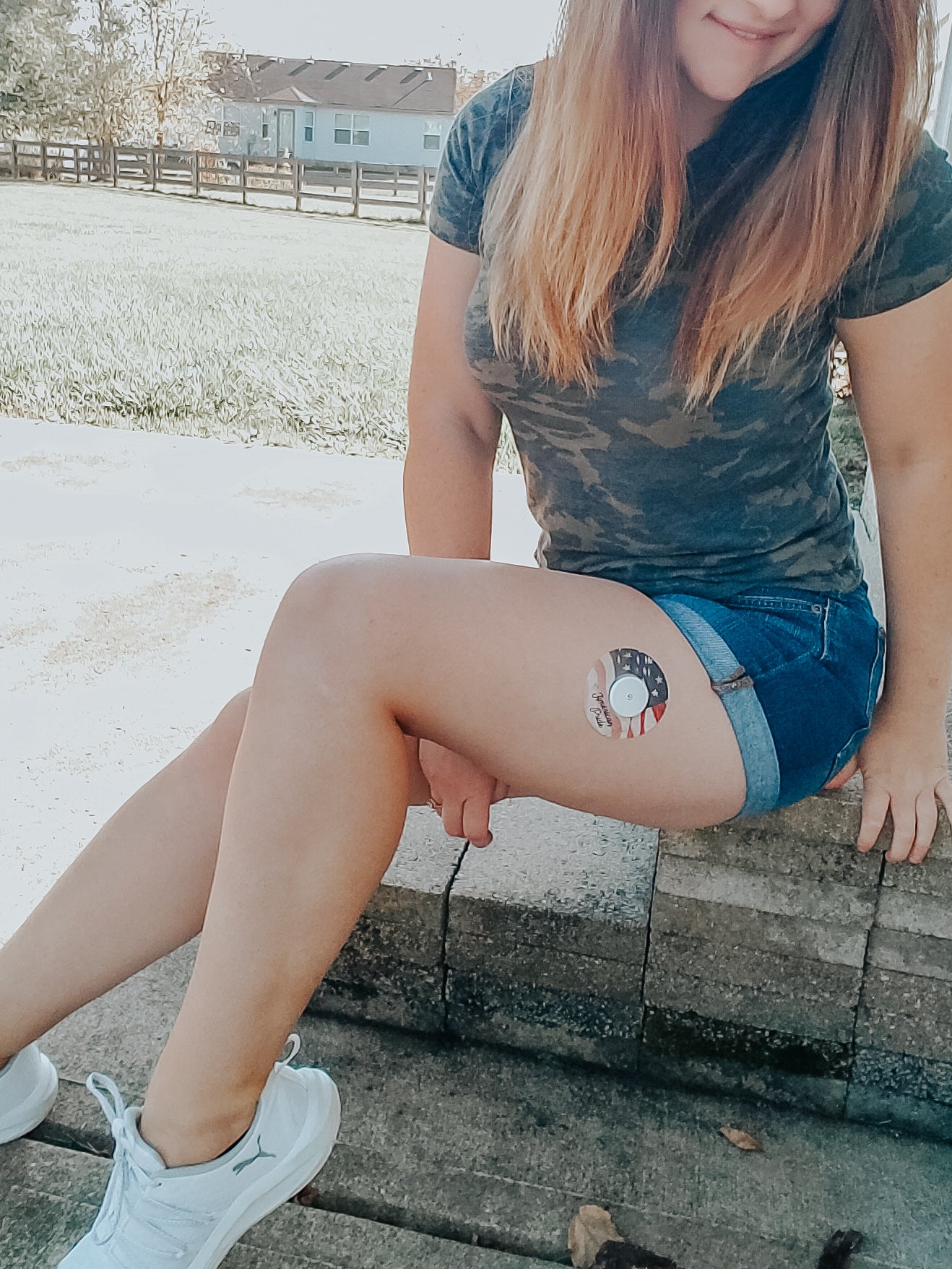 Girl outside with American Pride Libre Tape on leg, Abbott Lingo