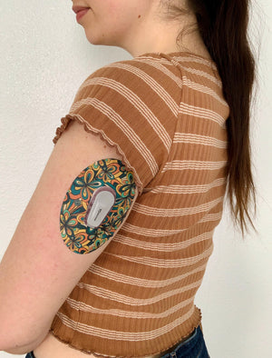 ExpressionMed, 70's Vintage Dexcom G6 Tape, Single Tape, Human Wearing Retro Floral Themed CGM Adhesive Patch Design 